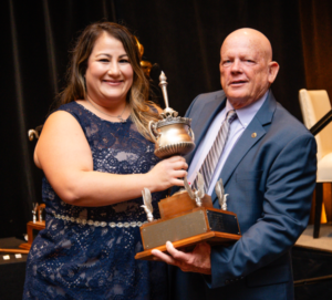 Misty Varsalone presents the Shorty Howard Trophy to Donnie Evans